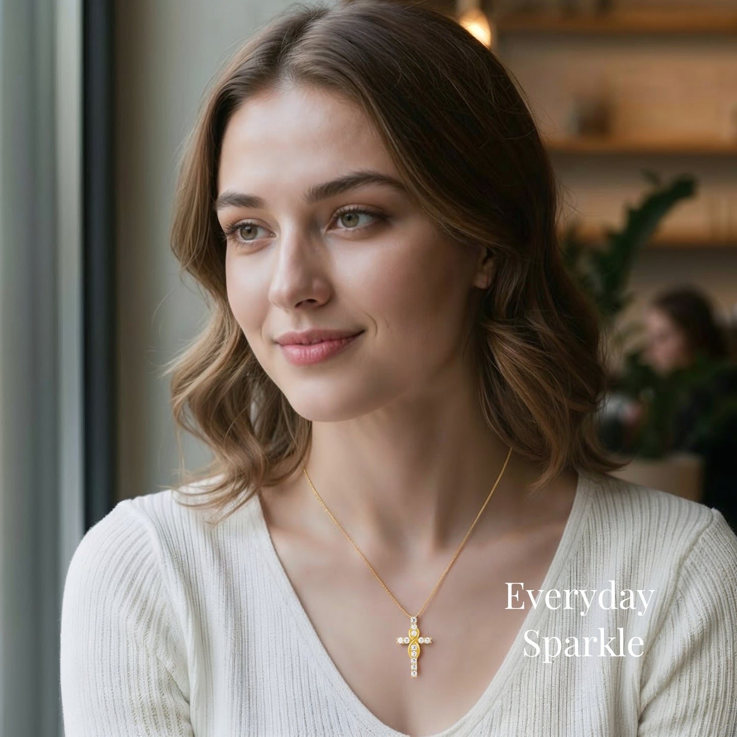 moissanite cross necklace collection featuring mobius designs in gold and silver worn in everyday cafe lifestyle showing elegant sparkle for daily wear jewelry