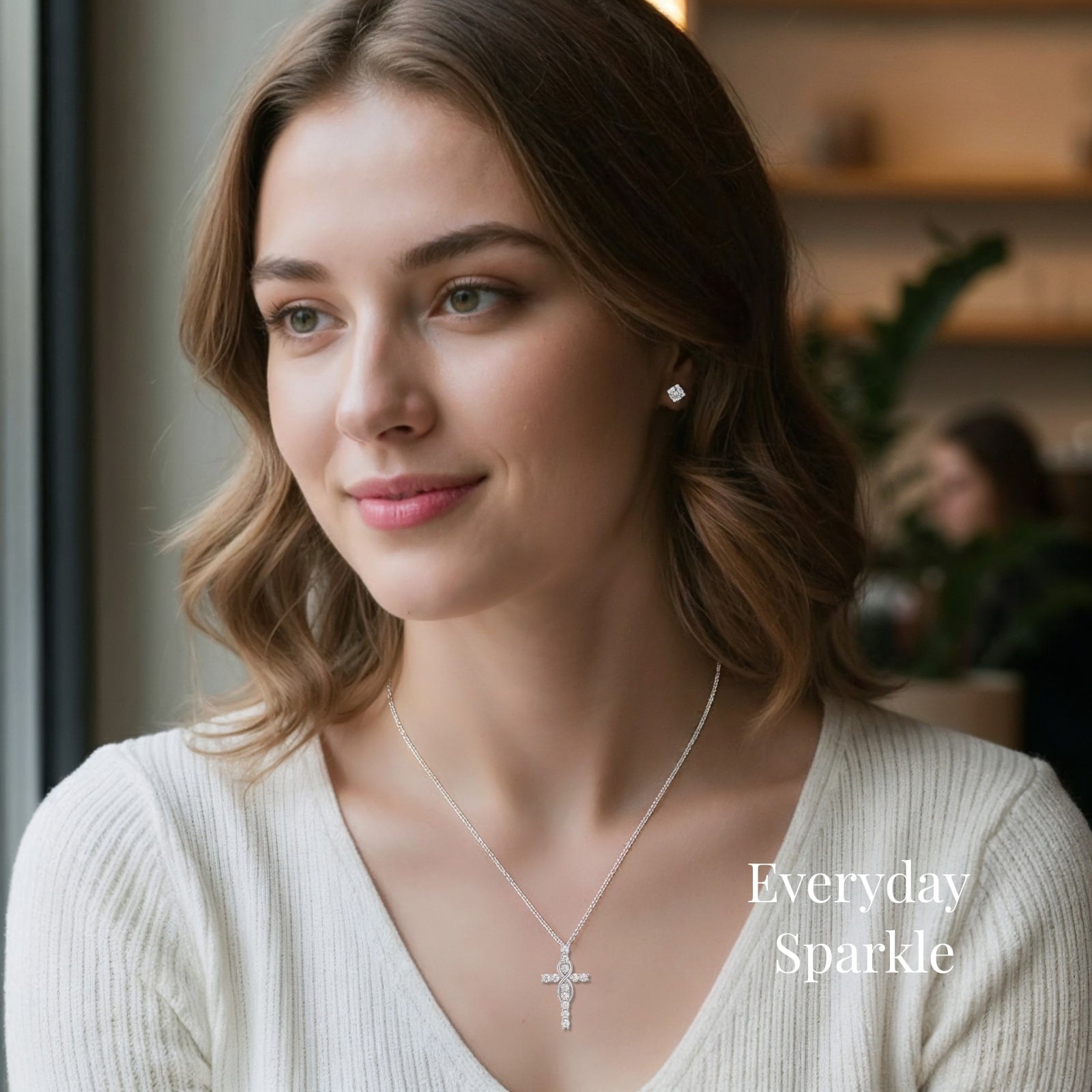 moissanite cross necklace collection featuring mobius designs in gold and silver worn in everyday cafe lifestyle showing elegant sparkle for daily wear jewelry