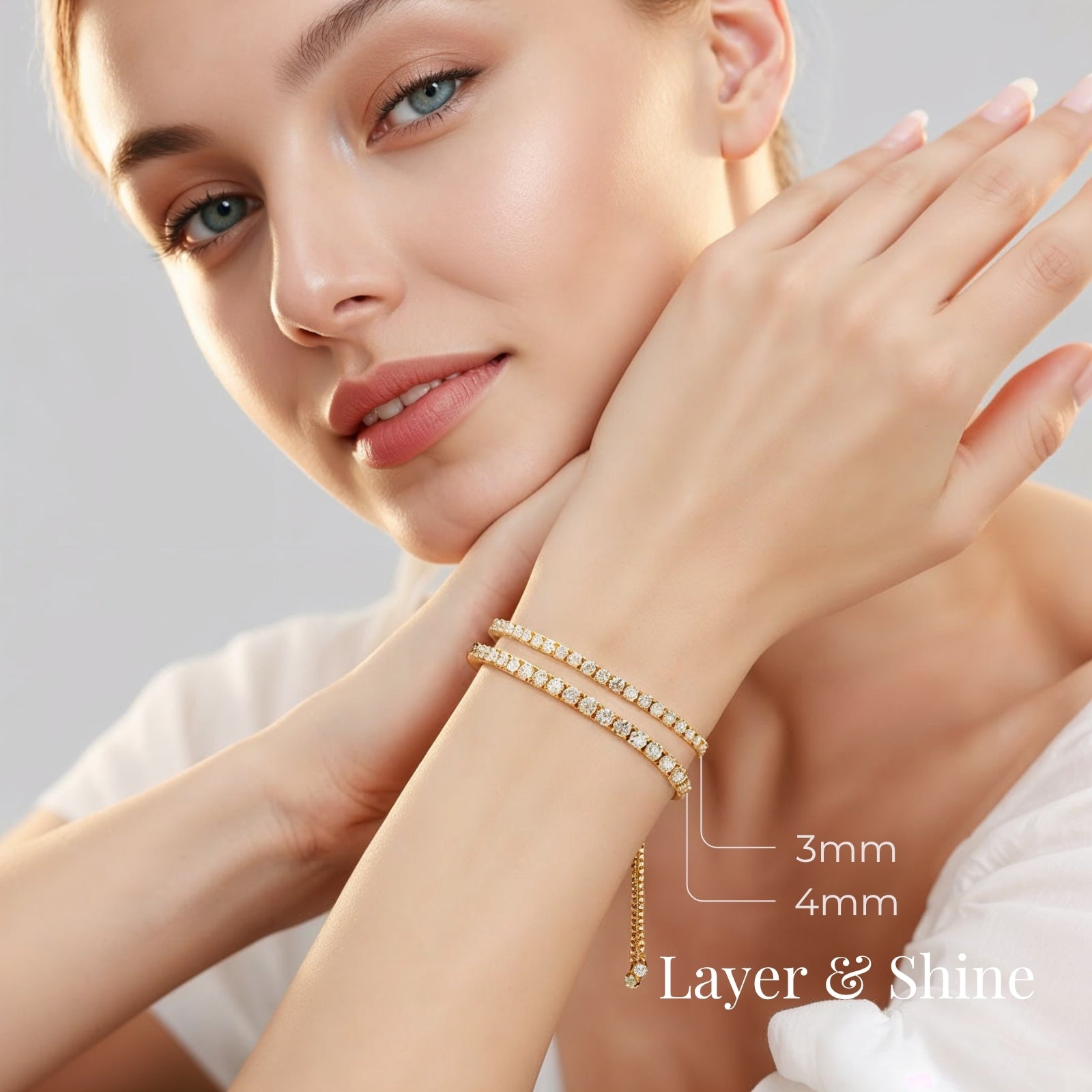 stacked 3mm and 4mm moissanite tennis bracelets on wrist in yellow gold plated silver